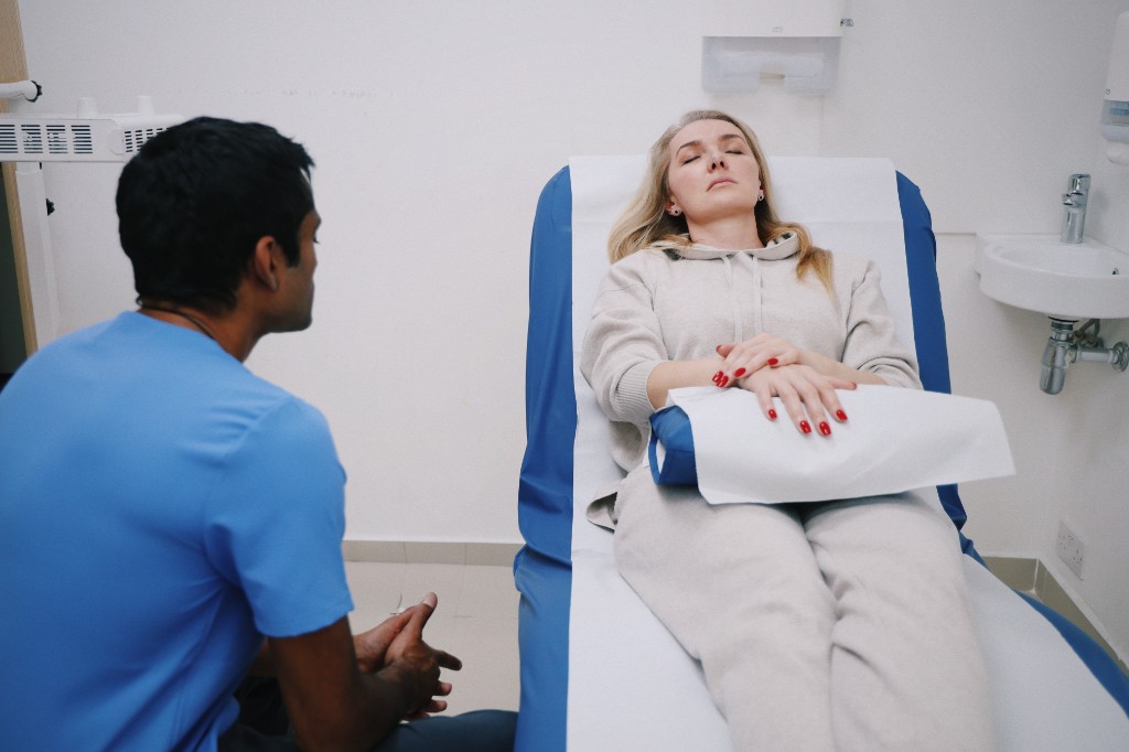 Dr Shehan in consultation with a patient